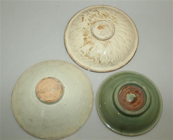 A Ding ware dish, a Yingqing bowl and a Longquan celadon dish, 12th - 15th century, 14cm